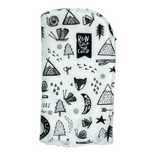 Load image into Gallery viewer, Folded burpcloth with black and white nature patterns.
