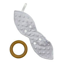 Load image into Gallery viewer, Back of Teething ring with zebra pattern on a coral pink background. Teether is shown unsnapped, ring separated, textured reverse fabric.
