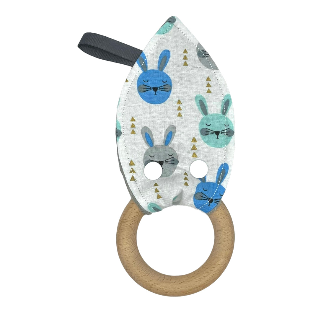 Baby Crinkle Teether by Mimi's Little Loveys. Fun blue & gray rabbits on a white background with metallic gold accents, and a wooden teething ring.